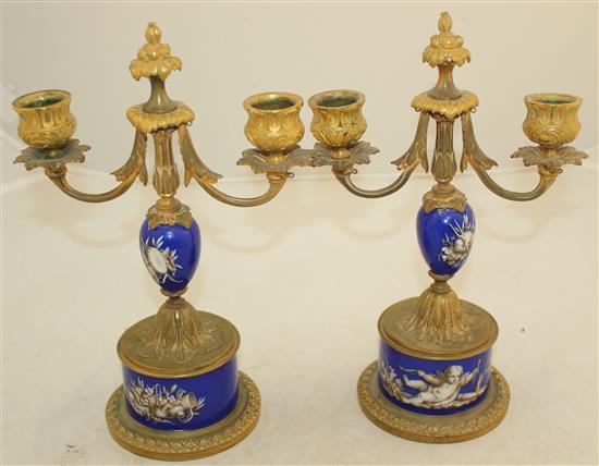 A pair of 19th century French ormolu mounted porcelain candelabra, 10in.